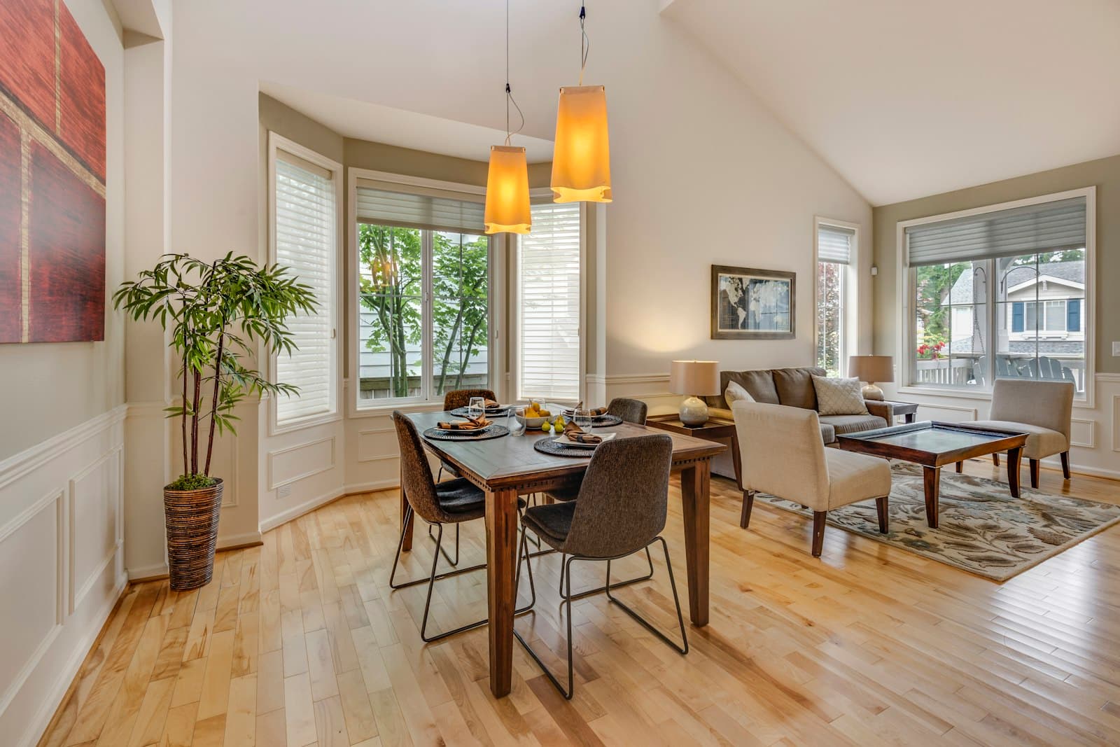 Bright, tidy dining and living area with wooden floors